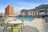 Resort-style pool with modern lounge seating.