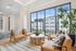 Lounge seating overlooking the resort-style pool and elegant architecture.