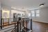 Bright and modern kitchen with sleek cabinetry, stainless steel appliances, and elegant lighting in a stylish urban apartment.