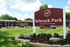 Inviting Schrock Park one-bedroom apartments with vibrant green lawns and ample parking, ideal for comfortable living.