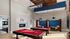 Entertainment room at our apartments in Athens, GA featuring two billiards tables and bench seating.