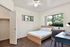Bedroom with huge windows in unit
