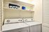 laundry closet with full size washer and dryer