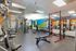 Vibrant and fully-equipped fitness center featuring state-of-the-art gym equipment and ample space for workouts.