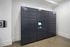 Modern package delivery hub in a sleek apartment setting, featuring a secure, automated locker system with convenient digital access.