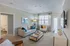 Spacious living room looking out to private patio