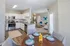 Dining area looking out to kitchen and living area