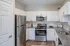 Kitchen with stainless steel appliances, backsplash, and granite countertops