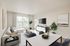Sophisticated living area leading out to balcony in an Ossining apartment for rent.