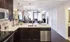KitchenModel kitchen at our apartments for rent in Atlanta, featuring white countertops and stainless steel appliances.