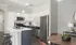 Marlborough MA apartment kitchen with wood cabinetry and stainless steel appliances.