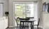 Dining space in a luxury Pembroke MA apartment with a patio view.