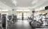 Interior view of the fitness center at Pembroke Woods apartments.