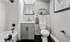 Designer bathroom with elegant all-white bath
