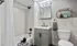 Designer bathroom with elegant all-white bath