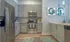 Model kitchen at our apartments in Sandy Springs, featuring wood grain floor paneling and stainless steel appliances.