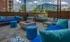 Outdoor lounge at our apartments in Sandy Springs, GA, featuring cushioned outdoor seats and a fire pit.