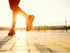 Woman running at sunset.