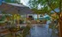 Outdoor common area at our apartments in Sandy Springs, featuring string lights, outdoor seating, and umbrellas.