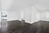 Large living room with wood-like floors