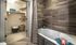 luxurious bathroom with large closet