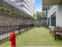 The dog park at our apartments for rent in Atlanta, featuring astroturf, benches, and a fire hydrant.