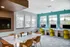 Avia Lowry's cyber lounge with Macbooks and a meeting space for residents to work from home.