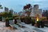 The deck lounge at our apartments in New York, featuring reclining chairs, potted plants, and a view of the city.