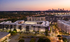 The exterior of the Newbergh ATL apartment complex in Atlanta, featuring a view of the Atlanta skyline.