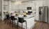 Model kitchen at our apartments for rent in Atlanta, featuring granite countertops and a kitchen island.