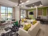Resident lounge at our Atlanta apartments for rent, featuring cushioned chairs and a flat screen TV.