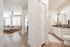 entry hallway with view of living room and bedroom