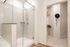 primary bathroom - walk in shower with view of walk in closet