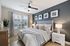 Bedroom with ceiling fan and vinyl plank flooring