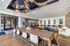 Clubhouse with large conference table, and dynamic light installation on the ceiling