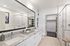 Bathroom with double vanity, standing shower and walkin closet