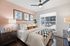 Primary Bedroom with king sized bed and accessories
