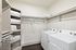 Closet with full sized washer and dryer