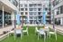 Social Courtyard with blue umbrellas and fun lighting