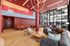 Clubhouse with soft seating and rope lights hanging from the ceiling