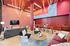 Clubhouse with soft seating and rope lights hanging from the ceiling