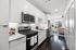 Studio kitchen with stainless steel appliances and gas stove