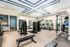 Fitness Center with tread mills, ellipticals, row machine, stair climber, and weight training
