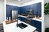 Modern kitchen with blue cabinets and spacious island