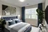 bedroom with window and plant