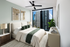 Spacious bedroom with floor-to-ceiling views of the stunning skyline