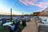 Rooftop seating area during sunset