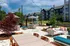 Outdoor poolside lounge with tables and seating