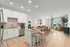 Photo of corner kitchen with island, open to living room
