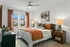 Bedroom with ceiling fan and queen sized bed